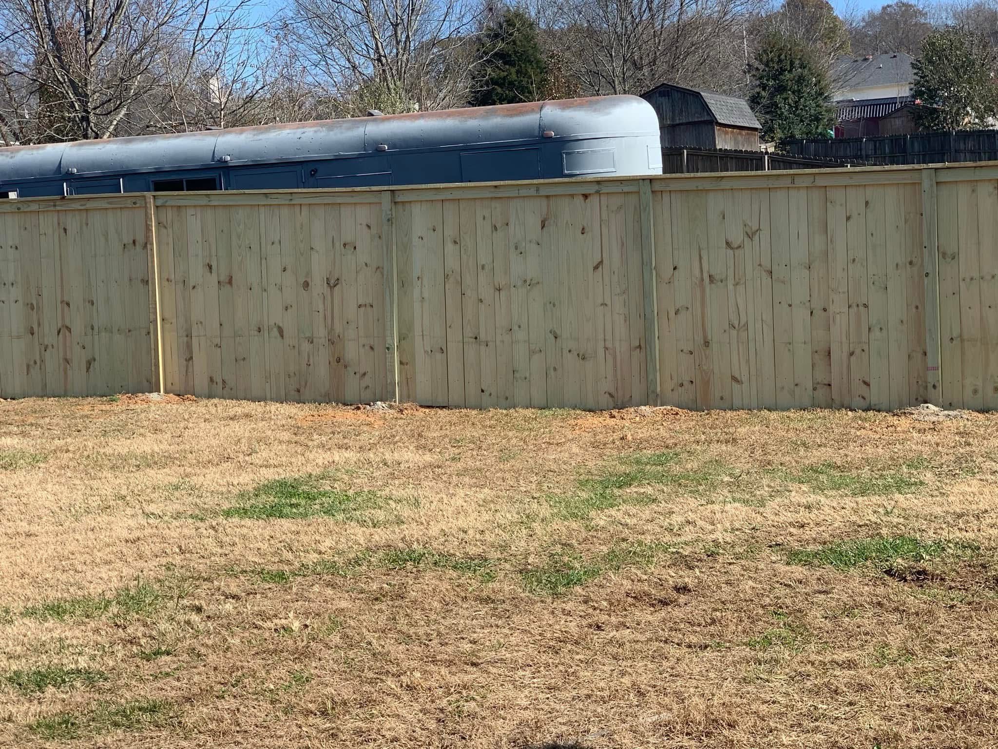 Wood privacy fence along a backyard in Middle Tennessee